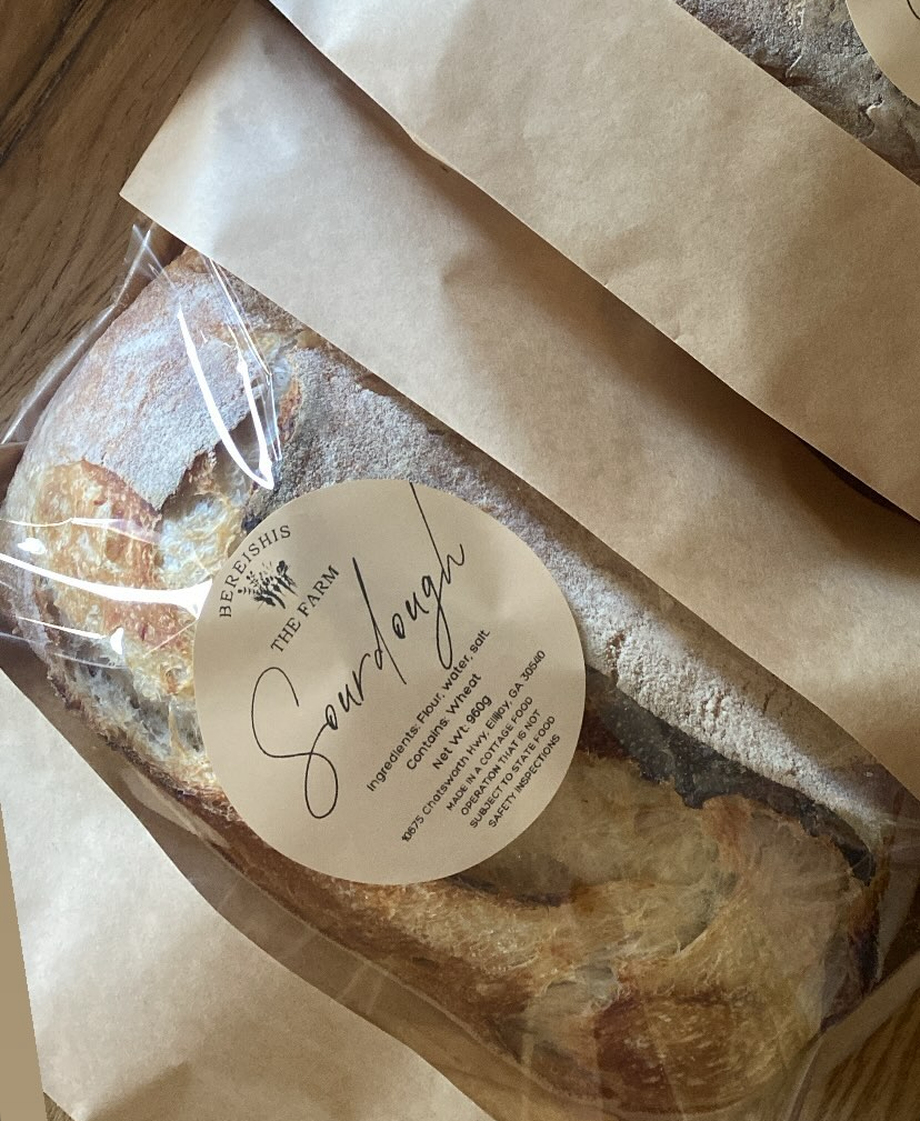 Organic sourdough bread made with organic flour, water, salt, and wheat, available at a charming, fully organic farm store located at 10675 Chatsworth Hwy, Ellijay, GA 30540. A fresh, homemade treat perfect for health-conscious customers