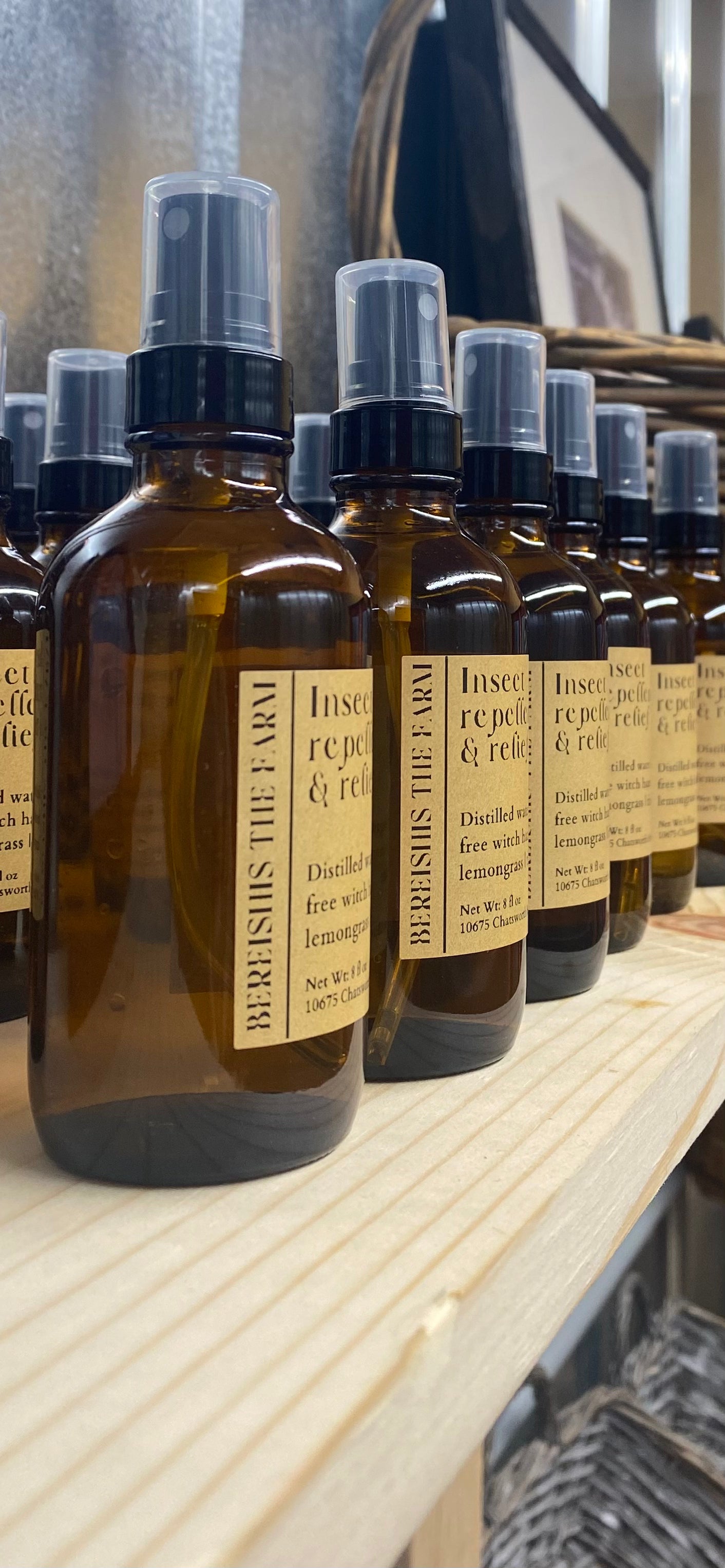 Organic insect repellent and relief made with Witch Hazel, Jojoba oil, Castor oil, Glycerin, and a natural essential oil blend (Citriodora, Rosemary, Lemongrass, Eucalyptus, Thyme) displayed in a charming, fully organic farm store in Ellijay, Georgia.